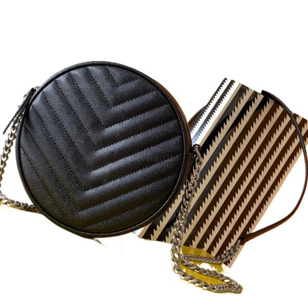 

99A This handbag, a top designer's creation, is handcrafted by skilled artisans. It is made of fine calfskin and adorned with exquisite hardware. It is a 17CM round shoulder, Two