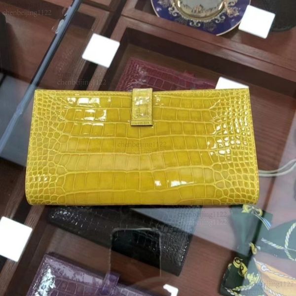 

99A The softness and toughness of South African crocodile skin are perfectly combined in this lady's handbag. It is designed by a top designer and custom-made by hand., Three