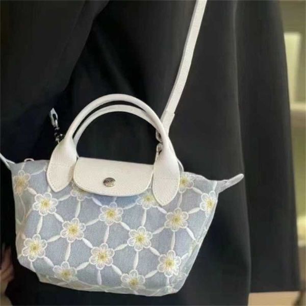 

Handbag high quality wallet designer bags Cross fashion Dumpling Limited Single Edition Wrapped Flower Bag Denim Handle Mini Box Hand-held Diagonal in Sky Blue
