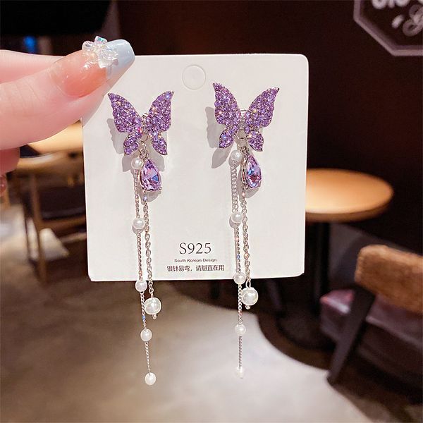 

Ethereal sweet butterfly earrings with a high-end socialite style long pearl tassel earrings.