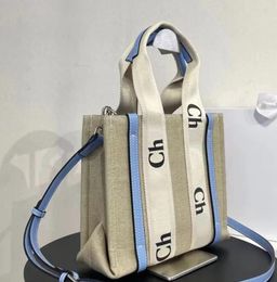 7 colores Bolsos para mujeres Bolsas de compras Woody Bag Bag Bags de calidad superior Moda Bolsas de playa Grandes Bolsos de lujo de Luxury Travel Crossbody Shoulder Fillet