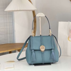 7a 1: 1 bolso de diseñador de lujo bolso para mujer Bolsos de piel de becerro Bolsos de hombro de cuero de vaca Bolso de mano de moda Borla Mango de cuero genuino Bolso trenzado Bolsas de totalizadores de calidad superior