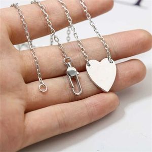 80% korting op designer sieraden armband ketting ringstijl heldere hartvormige hanger met eenvoudige damestrui voor heren