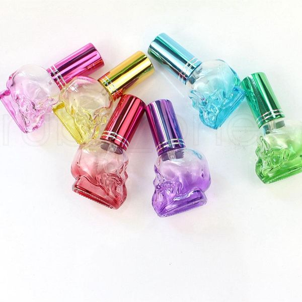 Mini botellas recargables de viaje portátiles vacías de 8ml, botellas de Perfume de cristal con forma de calavera, botella de Perfume de muestra, 7 colores
