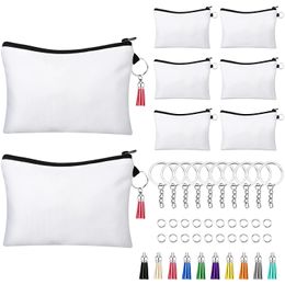 8pcs / ensemble Sacs de cosmétiques en blanc sublimation, y compris les sacs de maquillage de transfert de chaleur de bricolage avec fermeture éclair, les clés, les glands, les anneaux de saut pour l'artisanat de bricolage