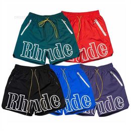 9P11 Rhude Short Pantalones cortos de malla para hombre Moda Hombres Mujeres Casual Monopatín reflectante Hip Hop Bolsillo de playa Pantalones cortos blancos de alta calidad Frontera Tamaño asiático S xl