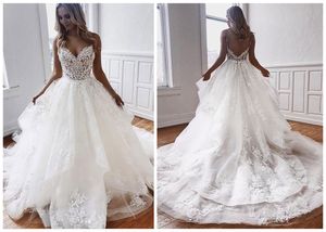 Une ligne sexy robes spaghetti bretelles illusion appliques en dentelle sans manches volants robes de mariée à plusieurs niveaux robe de mariée