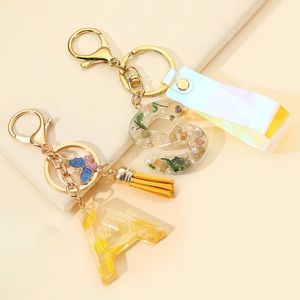 Acrylique papillon lettre porte-clés Alphabet anglais cristal femmes porte-clés anneau glands porte-clés porte-clés pendentif cadeaux pour les filles