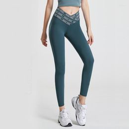 Actieve broek Hoge taille Dames Yoga Fitness-legging Gymtraining Naadloze achterzak Kruisprintontwerp Slanke broek die de heupen optilt