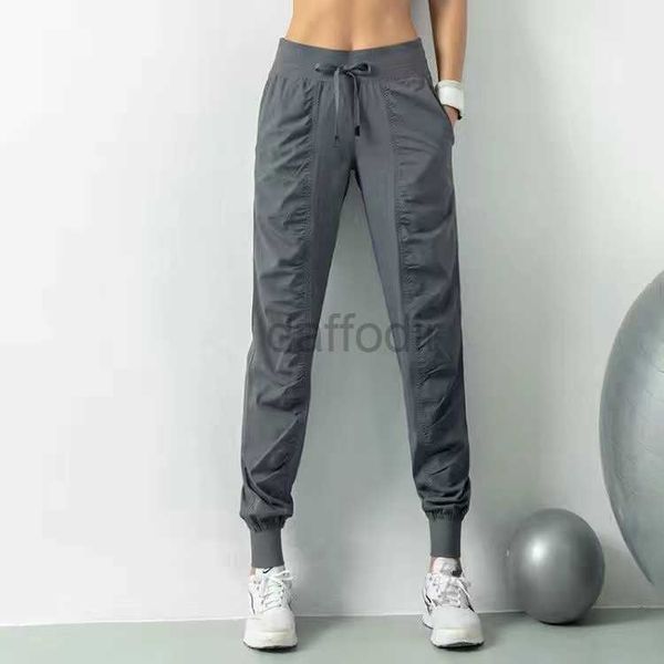 Active Pants LL femmes Yoga pantalons de Jogging pantalons de survêtement en vrac femmes Fitness sport Joggers en cours d'exécution Stretch minceur pieds pantalons de survêtement 240308