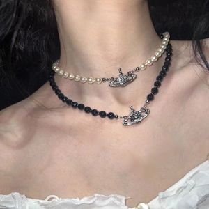 Advanced Western Empress Dowager Black Agate Diamond Saturn Pendant Collier de perle Lumière Luxur