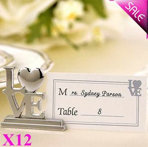 Supporto di carta elegante del posto di AMORE del metallo di trasporto 12PCS in sacchetto di organza che imballa l'idea della decorazione della tavola del partito di favori di nozze