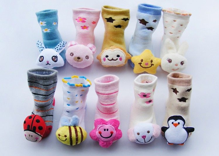 baby socks with toys on them