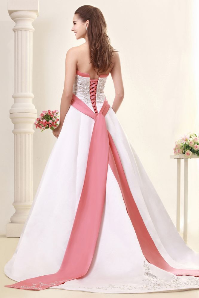 white wedding dress with pink accents