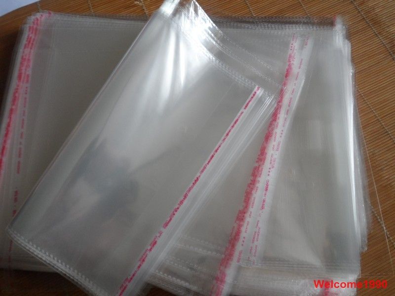 100st 24 * 34cm God kvalitet Opp Smycken Väska Bok / Klädpåse Förpackning Självhäftande tätning Klar plastpåse transparent