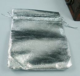 sac de championne
 Promotion 100pcs sacs à bijoux de gaze de gaze argentés pour des faveurs de mariage avec cordon de serrage 7x9cm