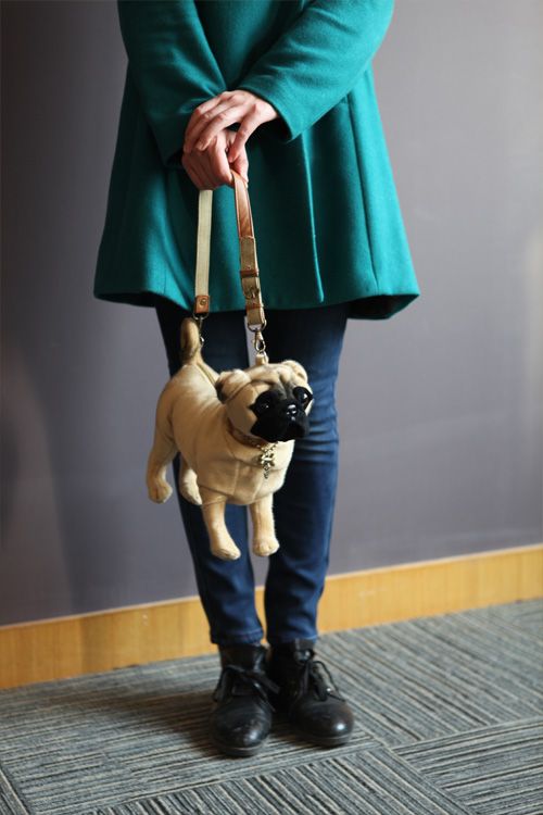 soft toy dog in handbag