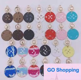 Porte-clés de voiture assorti avec tout, ornements ronds de marque, couleur contrastée, pendentif presbyte, vente en gros