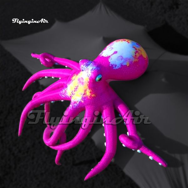 Incroyable grand ballon gonflable rose de poulpe avec de longs bras ventouse portant des tentacules pour la construction de décoration murale