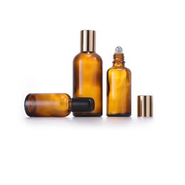 Botellas enrollables de vidrio ámbar con bola de rodillo de acero inoxidable Tapa negra / dorada para perfume de aceite esencial Tamaño recargable portátil 5ml 10ml 15ml 20ml 30ml 50ml 100ml