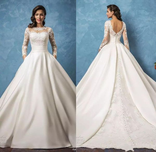 Amelia Sposa Vestidos de novia de encaje con bolsillos 2020 Mangas largas Cuello de joya Una línea Vestidos de novia Sin respaldo Tren de barrido Vestidos de satén AL6625