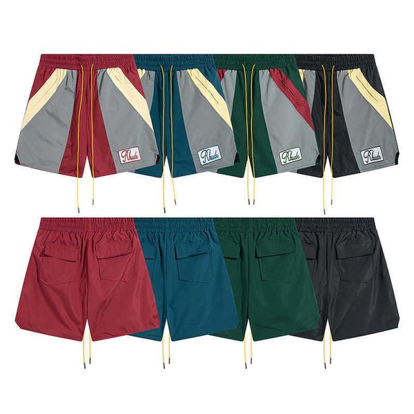 Pantalones cortos deportivos informales empalmados con bordado inglés de marca de moda americana para hombres y mujeres pantalones sueltos de secado rápido con cordón de cuarto