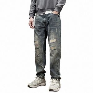 Mendigo de estilo americano pantalones vaqueros rasgados tendencia de otoño para hombres pantalones de pierna recta, sueltos todos los mares que adelgazan pantalones casuales para hombres s1rx #