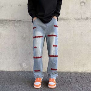 Amerikaanse stijl explosieve straatbroeken, mannelijk niche -ontwerp, geborduurde brief rechte been broek, vintage jeans