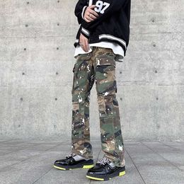 Pantalon de travail camouflage à l'encre éclaboussée de style américain pour hommes avec plusieurs poches, trous de jambe larges et droits, jean hip-hop tendance