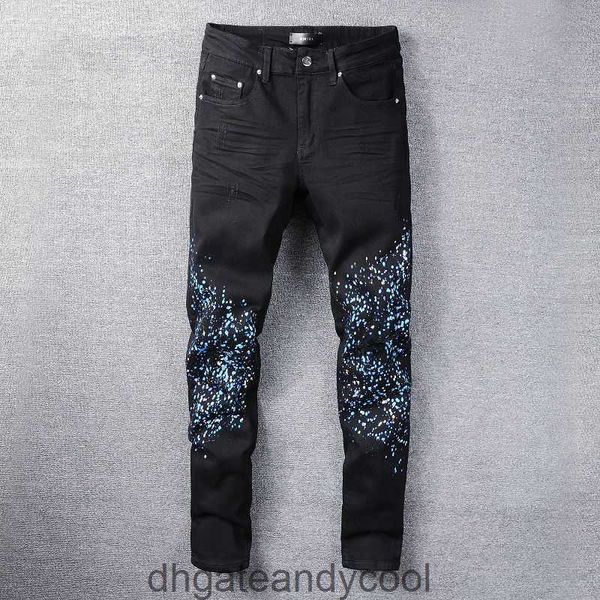 Amirres Jeans Pantalones de diseñador Hombre La nueva marca de moda lava Denim agua negro hace viejos agujeros salpicaduras de pintura en aerosol que adelgaza los pantalones vaqueros elásticos de los hombres altos 4VVN