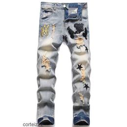 Amirs Men Jeans Designer Stacked for Mens Rips Skinny Ripped Black Pants with Holes Camisa de mezclilla Pierna recta Slim Fit Cremallera Amari Bikers Motocicleta BJAT