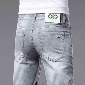 Et printemps été tendance jean hommes coupe ajustée élastique coréen petit pied pantalons longs marque