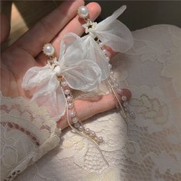 Boucles d'oreilles ange blanc avec nœud papillon, longues perles, pompon, pendentif d'oreille pour femmes, Design Vintage, Style coréen, boucles d'oreilles de luxe, charme Simple, cadeau, accessoires d'oreille parfaits