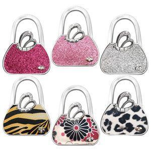 Ailes d'ange crochet de sac pliant personnalité de la mode de bureau motif irrégulier solide crochet antidérapant accessoires de bagages créatifs