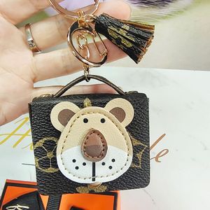 Porte-clés animal pour écouteurs Bluetooth, étui pour AirPods, fleur marron, tête de lion, sac de rangement, accessoires, portefeuille créatif, porte-pendentif pour clés de voiture