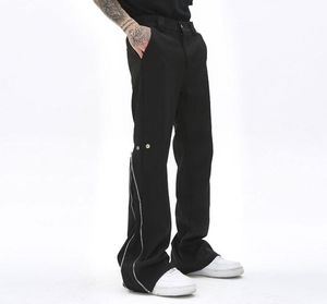 Enkel rits en knop vaste kleur retro heren spoor broek rechte zakken met oversized casual streetwear losse broek1339076