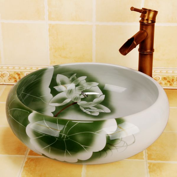 Lavandino da bagno in ceramica da appoggio in loto antico Lavabo rotondo con motivi geometrici
