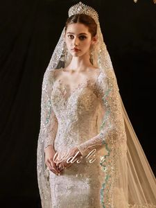 Árabe de manga larga sirena vestidos de novia Dubai moderno nuevo 2023 romántico magnífico rebordear encaje princesa vestido de novia por encargo apliques transparentes