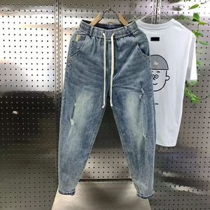 Arrivée coréenne décontractée cordon de gamme denim harem pantalon masculin jeans printemps automne mode hip hop lâches jeans lavés baggy 240424