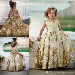 Aankomst Mooie nieuw gouden lovertjes Champagne Ball Jurk Flower Girl Jurken Lace Applique Backless met boog Beadings Pearls Kids Prom Jurk