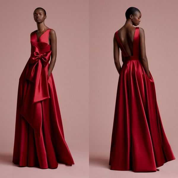 Aso Ebi Rose Vestidos de noche largos rojos Bolsillos Vestidos de noche sin espalda sexy nigerianos 2018 Vestido formal africano con cuello en V profundo y lazo Gonna