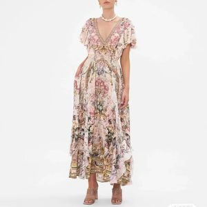 Australische designerjurk Zijden jurk met V-hals, korte mouwen en barokke bloemenprint
