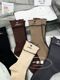Automne et hiver nouveau chaussette coréenne de style coréen des lettres de verrouillage personnalisées pour femmes chaussettes de pile de mode uster pantalon de requin assorti de style occidental