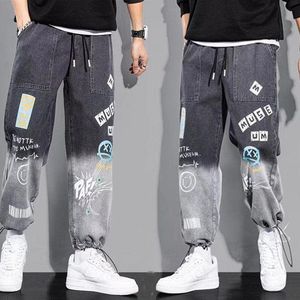 Pantalones para hombre otoño Graffiti tobillo vaqueros con bandas estilo coreano sueltos Casual Harem hombres moda japonesa pantalones de calle