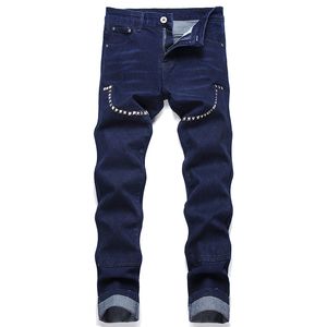 Herfst punkstijl klinknagel herenjeans blauw stiksel collage slanke rek broek lente zomer casual denim broek pantalones para hombre vaqueros