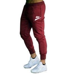 Automne hiver nouveaux pantalons pour hommes Jogging course mâle Sport Fitness Sportswear respirant pantalons décontractés marque LOGO imprimer