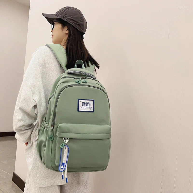 Рюкзак бросает женскую младшую среднюю школу большие емкости компьютер 2024 INS College Girl рюкзаки