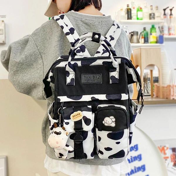 Sac à dos mode motif de vache imprimé femmes Black Emperproof Schoolbags pour adolescents filles portables sacs à dos kawaii dames sacs