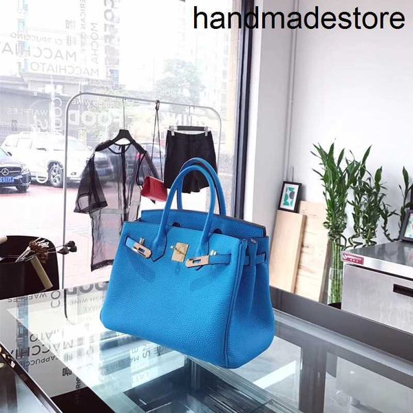 Bolso Tote de diseñador Azul cielo Grano de lichi Capa superior Cuero de vaca Cuero Bolso de cuero suave brillante para mujer Mensajero de un solo hombro