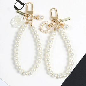 Pièces de sac Accessoires 1PC Pendentif Porte-clés Étui de téléphone portable Chaîne Perle Chaîne Décoration Accessoire DIY Boucle Anneau Crochet Porte-clés 231219